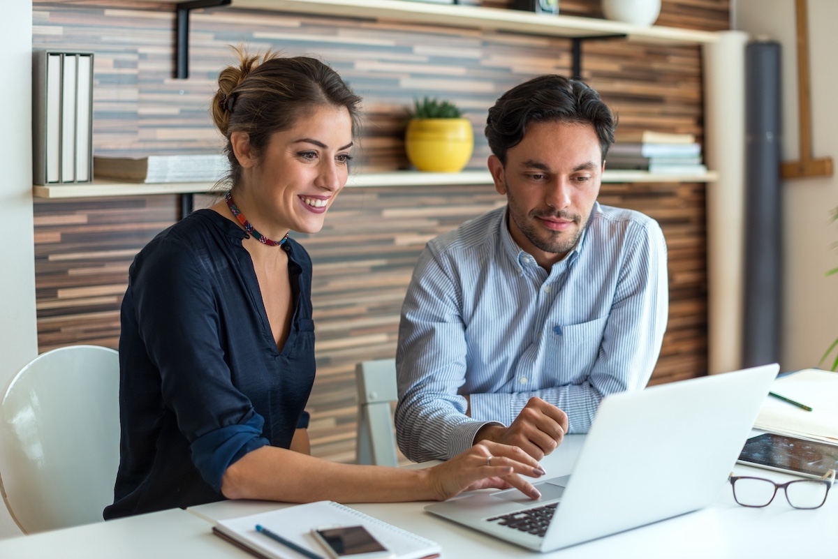 Two professionals collaborating on a custom solution